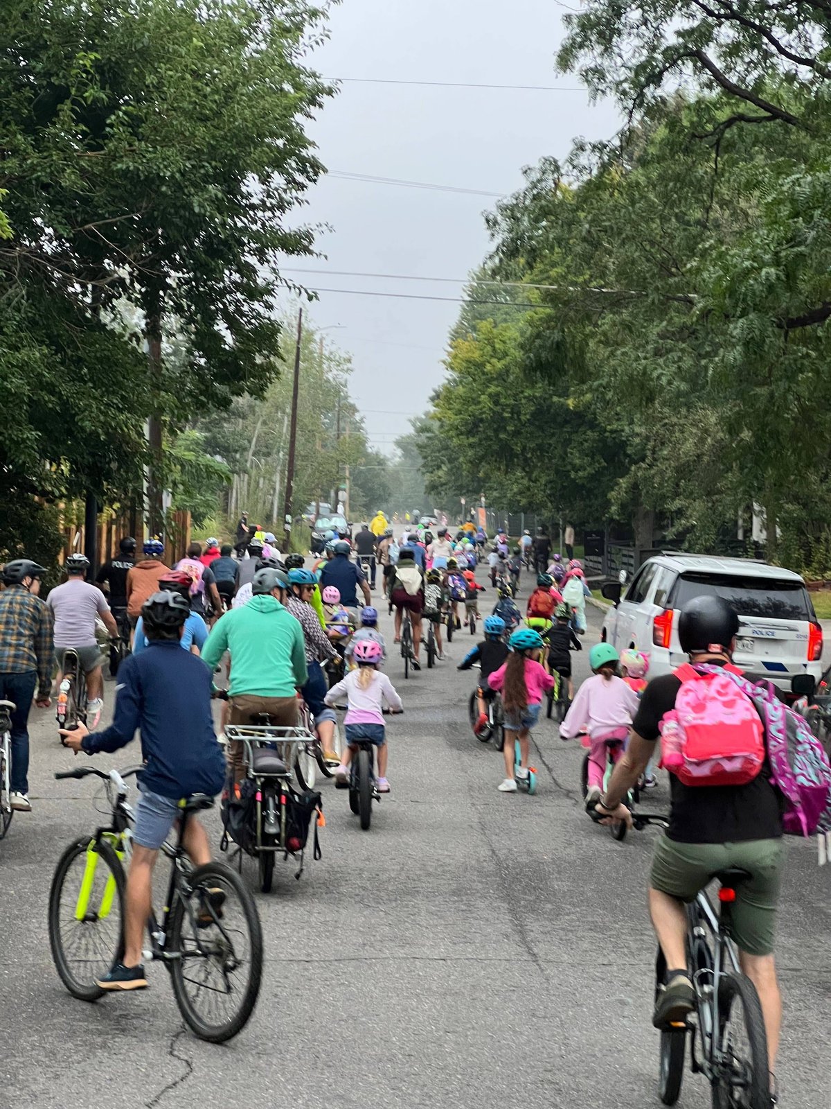 A group of kids riding bikes to school together